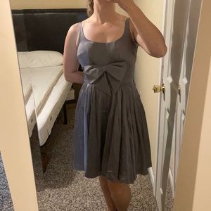 Silver satin party dress with bow